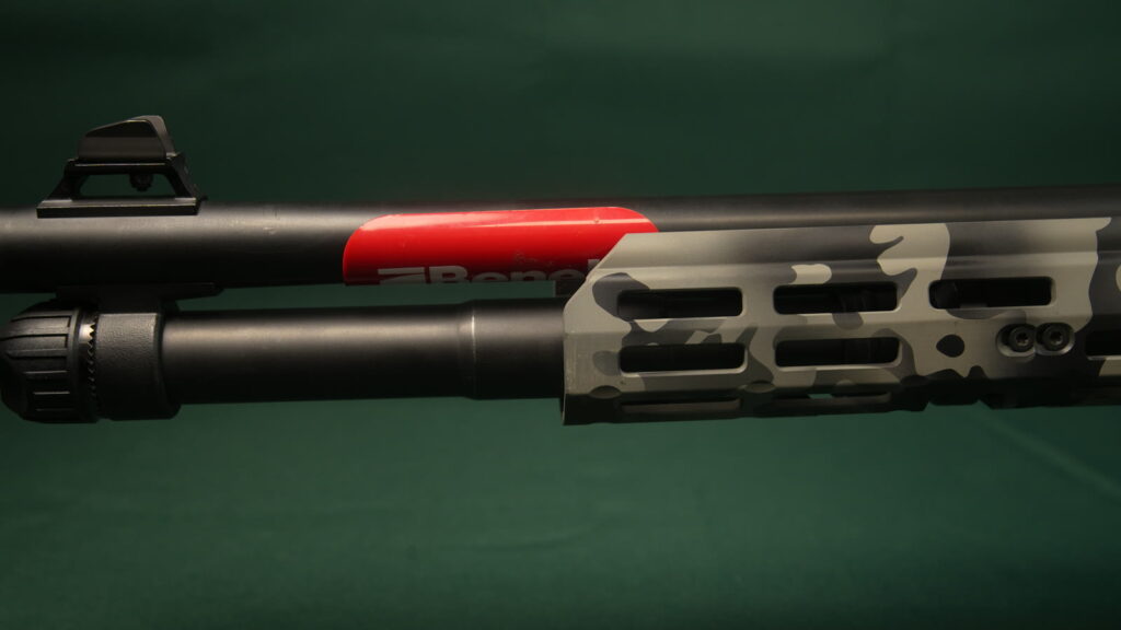 M-LOK handguard and magazine tube on a gray camo Benelli M4
