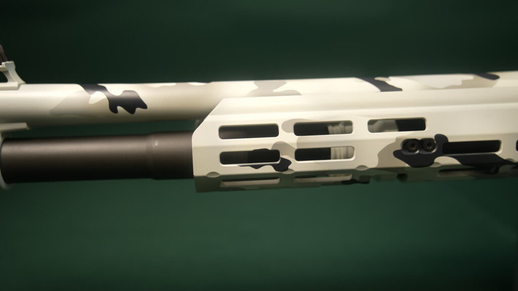 Midwest Industries M-LOK handguard on a white camo Benelli M4